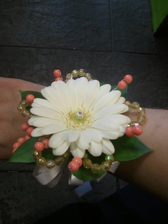 Eileen Jenkins Gerbera/coral bead wristcorsage